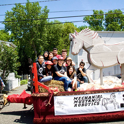 The Mechanical Mustangs participate in the Clifton Bicentennial Parade on their team-built float.
