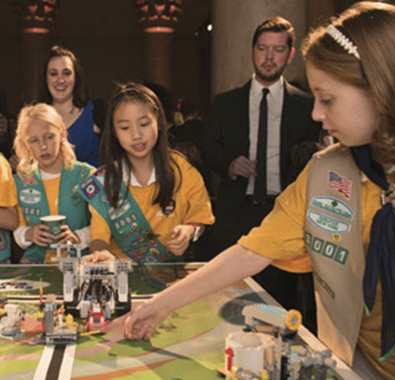 Members of the Girl Scouts of Greater New York demonstrate their FIRST LEGO League robot.