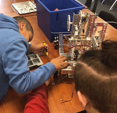 Students at Boys and Girls Haven in Louisville, Kentucky, build a robot for FIRST Tech Challenge.