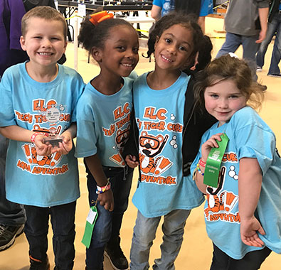 Students from St. Martinville, Louisiana, celebrate their achievements at a FIRST LEGO League Jr. expo.